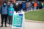 People wait in line at a walk-up vaccination site in Washington, DC, in November 2021.