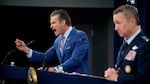 Defense Secretary Pete Hegseth (L), accompanied by Chairman of the Joint Chiefs of Staff Air Force Gen. Dan Caine (R), speaks during a news conference at the Pentagon on Thursday about the U.S. airstrikes against Iran's nuclear facilities.