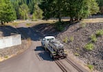 A tanker truck hauls salmon upriver past dams on the Willamette River system. The Corps has been trucking adult fish upriver past dams for many years. It now proposes hauling juvenile fish downstream as well. 