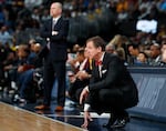 Trail Blazer coach Terry Stotts kneels during a playoff game in Portland, Oregon.