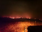 A ridgeline at night on fire.