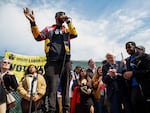 Amazon Labor Union leader Chris Smalls speaks next to U.S. Senator Bernie Sanders (I-VT) during a union rally outside an Amazon warehouse on Staten Island on April 24, 2022.