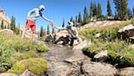 Matthew Morriss is handing Scott Hotaling insulated gloves as they install a water level gage in a stream below the White Pine rock glacier in Little Cottonwood Canyon, UT.