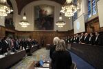 Judges and parties stand up during a hearing at the International Court of Justice in The Hague, Netherlands, Friday. The United Nations' court opened hearings Thursday into South Africa's allegation that Israel's war with Hamas amounts to genocide against Palestinians, a claim that Israel strongly denies.