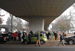 Attendees wait in line for food at Washington Jefferson Park on Dec. 6, 2024.