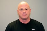 This undated photo provided by the Grapevine Police Department in Texas in January 2021 shows Larry Rendall Brock Jr. During the deadly riot at the U.S. Capitol on Wednesday, Jan. 6, 2021, Brock was photographed on the Senate floor wearing a helmet and heavy vest and carrying zip-tie handcuffs. The retired Air Force officer was arrested in Texas and charged Sunday, Jan. 10 in federal court in the District of Columbia.