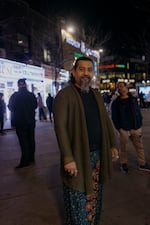 Amen Kahn, 56, a 12-year resident of the Jackson Heights neighborhood, stands for a portrait in Diversity Plaza on Tuesday.