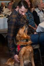 Ryan and his dog Twitch, the 200th dog to graduate from Northwest Battle Buddies, attend a graduation ceremony for the new cohort.