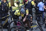 Portland Police arrest a young woman at a protest on Sept. 10, 2017.