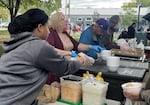 Breakfast Brigade volunteers serving meals on Sept. 27, 2024. The group is now changing its name to Neighbors Feeding Neighbors.