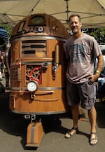 Chris Malone posed with his hand crafted R2D2 interpretation. It was a crowd favorite, many families stopped by to pose for pictures with it.