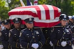 The casket of Staff Sgt. Angel S. Rampersad, who was killed in the ongoing war between the U.S. and Iran, is carried by NYPD officers during the funeral procession in New York on Friday, July 31.