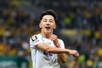 Uzbekistan's Abbosbek Fayzullaev celebrates after scoring his team's first goal during the World Cup Group K soccer match between Uzbekistan and Colombia in Mexico City, Wednesday, June 17, 2026.