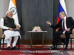 Russian President Vladimir Putin (right) meets with Indian Prime Minister Narendra Modi on the sidelines of the Shanghai Cooperation Organization leaders' summit in Samarkand, Uzbekistan, on Sept. 16, 2022.