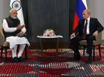 Russian President Vladimir Putin (right) meets with India's Prime Minister Narendra Modi on the sidelines of the Shanghai Cooperation Organization leaders' summit in Samarkand, Uzbekistan, on Sept. 16.