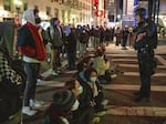 Students arrested at Emerson College last week won't face disciplinary action from the school, its president announced.