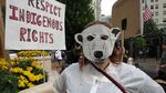 Penny Dex dresses as a polar bear to protest oil and gas drilling in the Arctic.