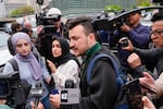 Khalil, center, surrounded by members of the media outside the Columbia University campus in April 2024.