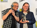 McCloud (left) and his co-author, Telgemire, holding their awards.