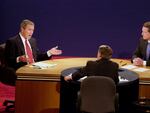 Democratic presidential candidate Vice President Al Gore listens as Republican presidential candidate Texas Gov. George W. Bush, left, answers a question from moderator Jim Lehrer during a debate Wednesday, Oct. 11, 2000, at Wait Chapel at Wake Forest University in Winston-Salem, N.C.