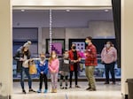 Families wait for their turn at a pediatric COVID-19 vaccine clinic for children ages 5 through11 years old at Clackamas Town Center in this November 2021 file photo. 