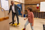 In this provided photo, Beaverton superintendent Tony Smith, left, practices balancing with a student at Oak Hills Elementary School during a June 2026 visit.