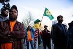 A man on stilts wears state of Jefferson regalia at a Timber Unity rally in front of the Oregon Capitol in Salem, Ore., Thursday, Feb. 6, 2020.