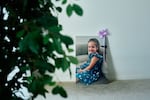 A poster of Avery, 4, that was displayed at her funeral. She smiling while wearing a dress with daisies on it.