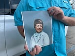 Mike Sennett holds a photo of his mother, Elizabeth. Kenneth Smith was sentenced to death in 1996 for his role in the murder-for-hire killing.