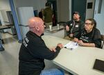 Alan Evans, left, chats with State Sen. Betsy Johnson, D-Scappoose, a vocal supporter of the plan to convert the never-used Wapato Jail into a service center for the region's homeless. 