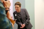 Democrat Carolyn Long checks initial returns in Washington's Aug. 7, 2018, primary election. Long will face Republican Rep. Jaime Herrera Beutler in the state's 3rd Congressional District during November's General Election.