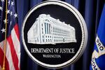 The logo for the Justice Department is seen before a news conference at the Department of Justice on Aug. 23, 2024, in Washington.