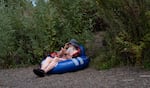 Jack Hudson rests on the beach after a the float. 