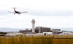 A plane lands at Portland International Airport.