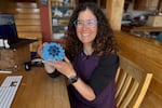 Rachael Z. Miller, founder of the Vermont-based Rozalia Project for a Clean Ocean, displays a Cora Ball, a laundry ball that can be tossed into the washer to cut down on clothes banging into each other and also catches microfibers, on Thursday, April 17, 2025, in Granville, Vt.