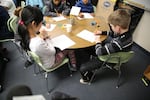 Anna and Johnathan sit at a table together in the classroom they visit once every two weeks, as part of the David Douglas School District program for students identified as Talented And Gifted.