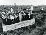 On the Fourth of July, children rode through town on a violin-shaped float.