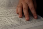 A participant reads the Torah.