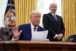 President Trump is joined by Commerce Secretary Howard Lutnick, who oversees the Census Bureau, as he speaks in the White House’s Oval Office in 2025.