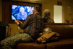 A man claps for testimony on Senate Bill 978 at the Capitol in Salem, Ore., Tuesday, April 2, 2019. An amendment to the bill before the Senate judiciary committee required safe storage of firearms, allowed retailers to refuse some gun sales and more.