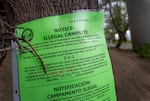 A notice of an illegal campsite, posted along the Vera Katz Eastbank Esplanade in Portland, March 26, 2024.