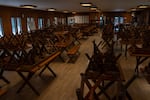Chairs and tables are stacked in the dining hall at the 103-year-old camp.