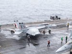 In this photo provided by the U.S. Navy, a U.S. fighter jet prepares to take off from USS Theodore Roosevelt aircraft carrier during the Freedom Edge exercise by the U.S., Japan and South Korea in Sea of Japan on June 28.