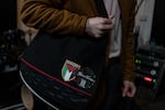 A pro-Palestinian badge can be seen on the bag of Breandan McGlone, lead guitarist for The Shan Vans, an Irish-language rock band, during a practice session at the Blackstaff Mill music studios in West Belfast, Northern Ireland, on Feb. 9.