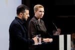 Denmark's prime minister, Mette Frederiksen (right), and Ukrainian President Volodymyr Zelenskyy attend a news conference at the European Political Community summit in Copenhagen, Denmark, on Thursday.