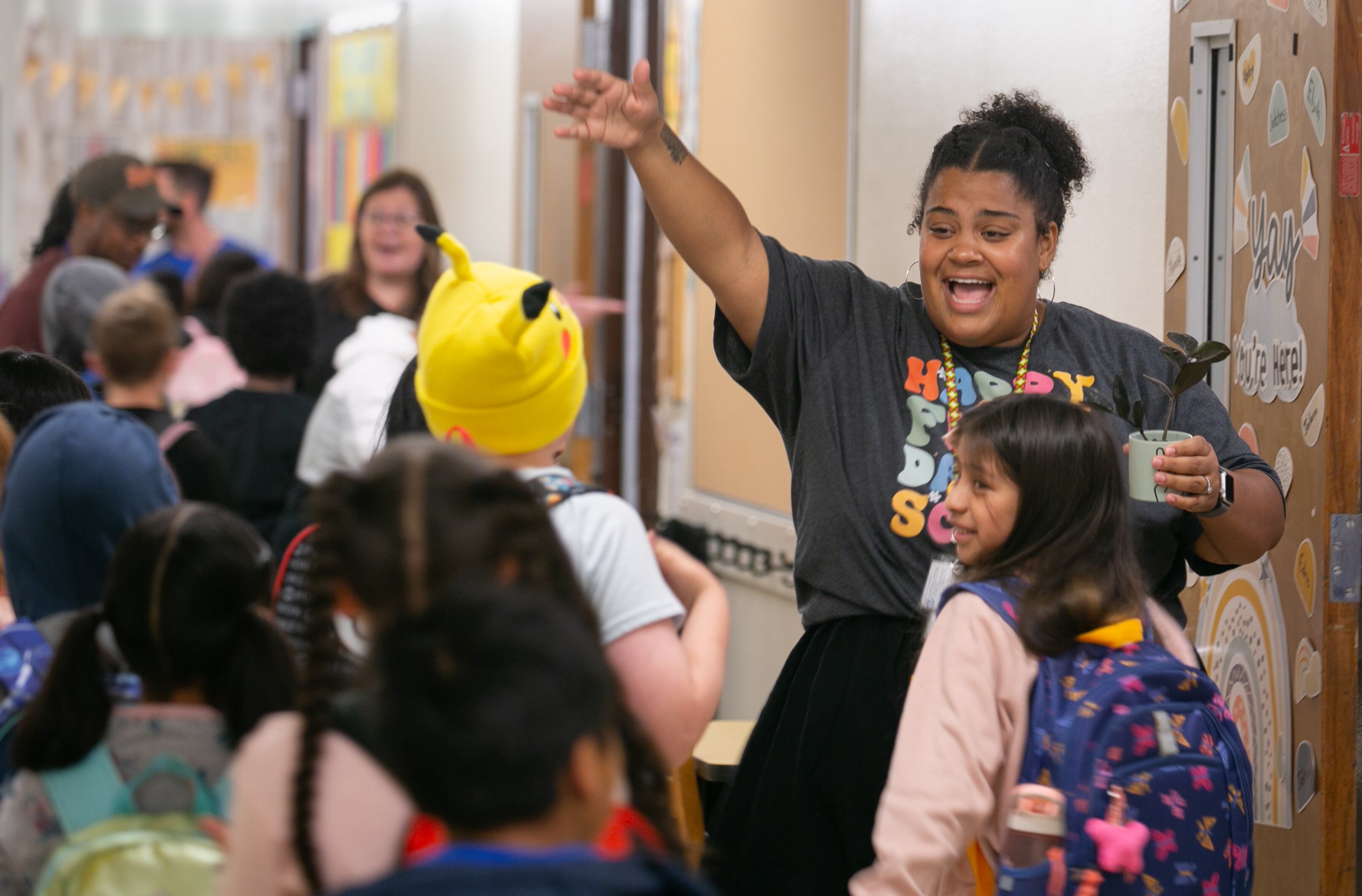 Emilie Elobt, a teacher at Sitton Elementary in Portland, welcomes students into her classroom on the first day of school on August 29, 2023. Elobt had hugs and high-fives for students she had in past years and new students in her classroom.