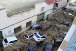 TOPSHOT - A picture taken in Picanya, near Valencia, eastern Spain, on October 30, 2024 shows cars piled in a stree after floods. Floods triggered by torrential rains in Spain's eastern Valencia region has left 51 people dead, rescue services said on October 30. (Photo by Jose Jordan / AFP) (Photo by JOSE JORDAN/AFP via Getty Images)