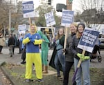 Members of the Portland Association of Teachers rally at Northwest 23rd Avenue and Burnside Street on Wednesday.