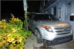 A crime scene photograph shows Christopher Knipe's Ford Explorer left at the scene where he hit and killed Sean Kealiher on Oct. 12, 2019 in Northeast Portland. Knipe, who confessed to driving the car and hitting Kealiher, originally claimed his car was stolen and denied being in the area.