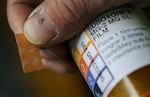 A patient holds his Suboxone prescription.